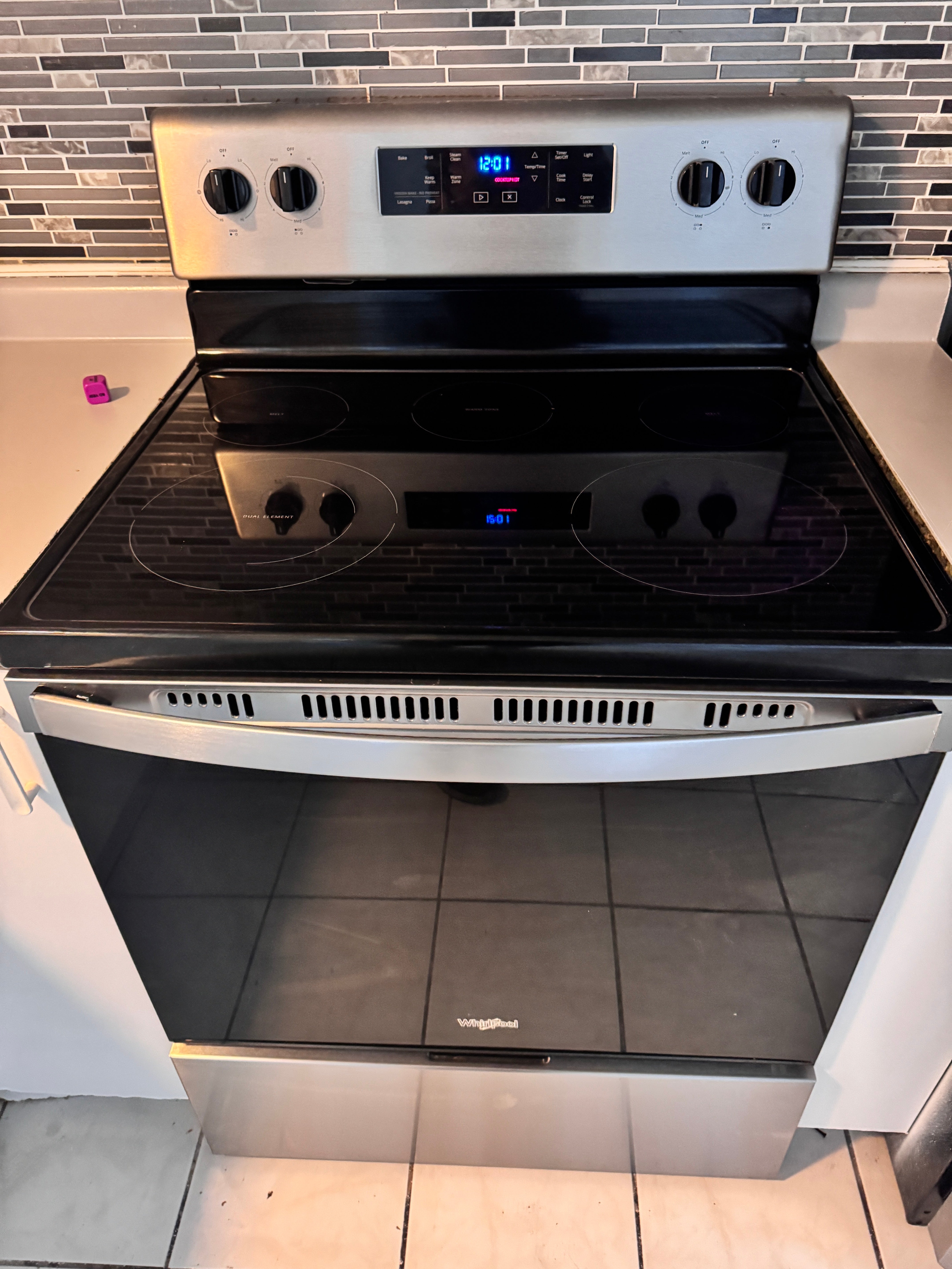 Whirlpool Stainless Steel Electric Stove (Model: WFE505W0JS0) GE Dryer (Model: HTX24EASK0WS)