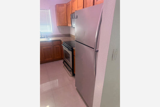 Black Top and Bottom Refrigerator installed in Hollywood, FL 33021