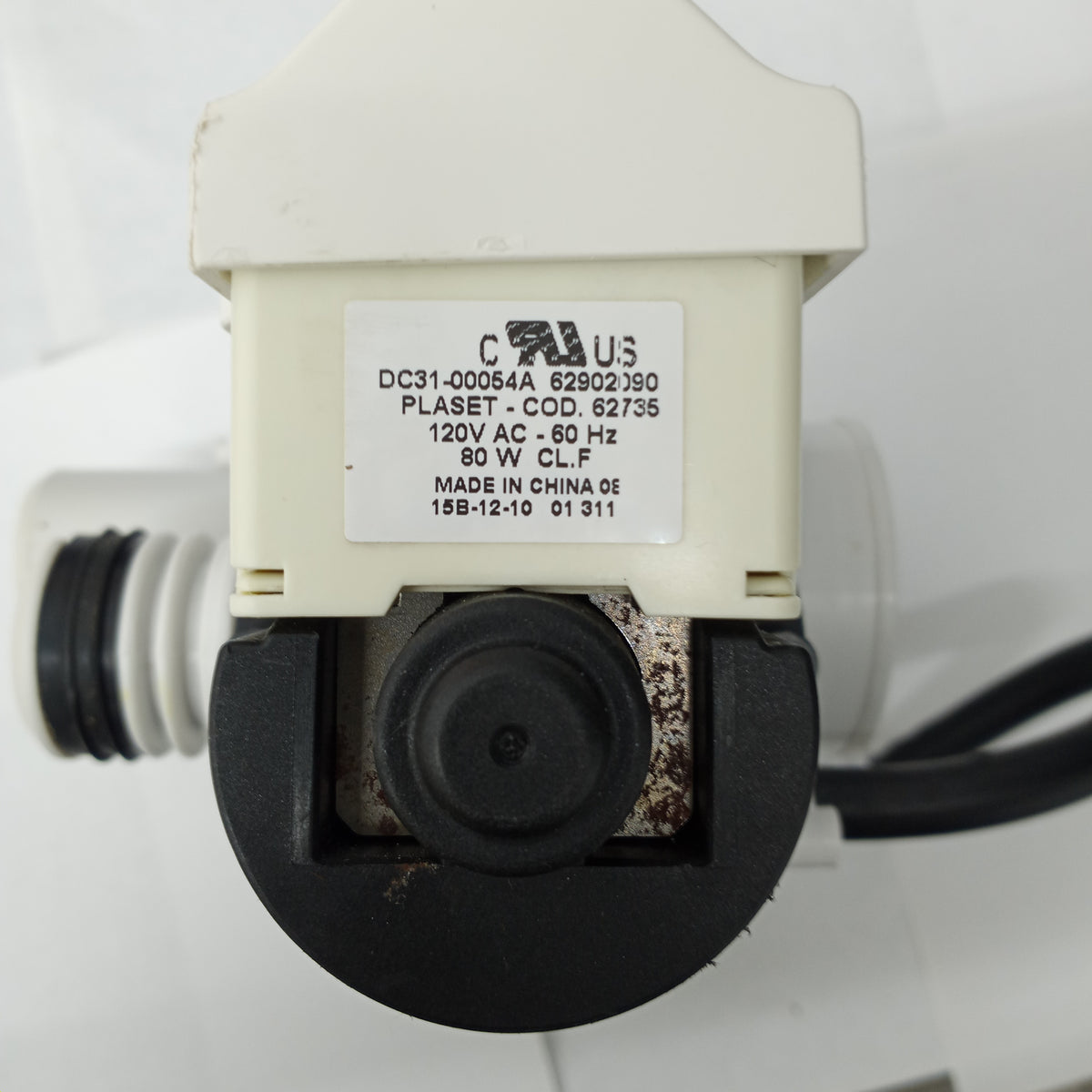 Samsung washer drain pump motor, model number DC31-00054A, with visible signs of wear and brand markings.